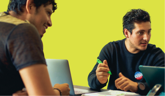 Poll worker helping a voter